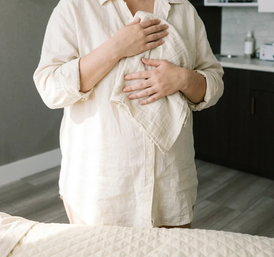 A young mother in cream linen, post-pregnancy, in The Bluffs treatment room